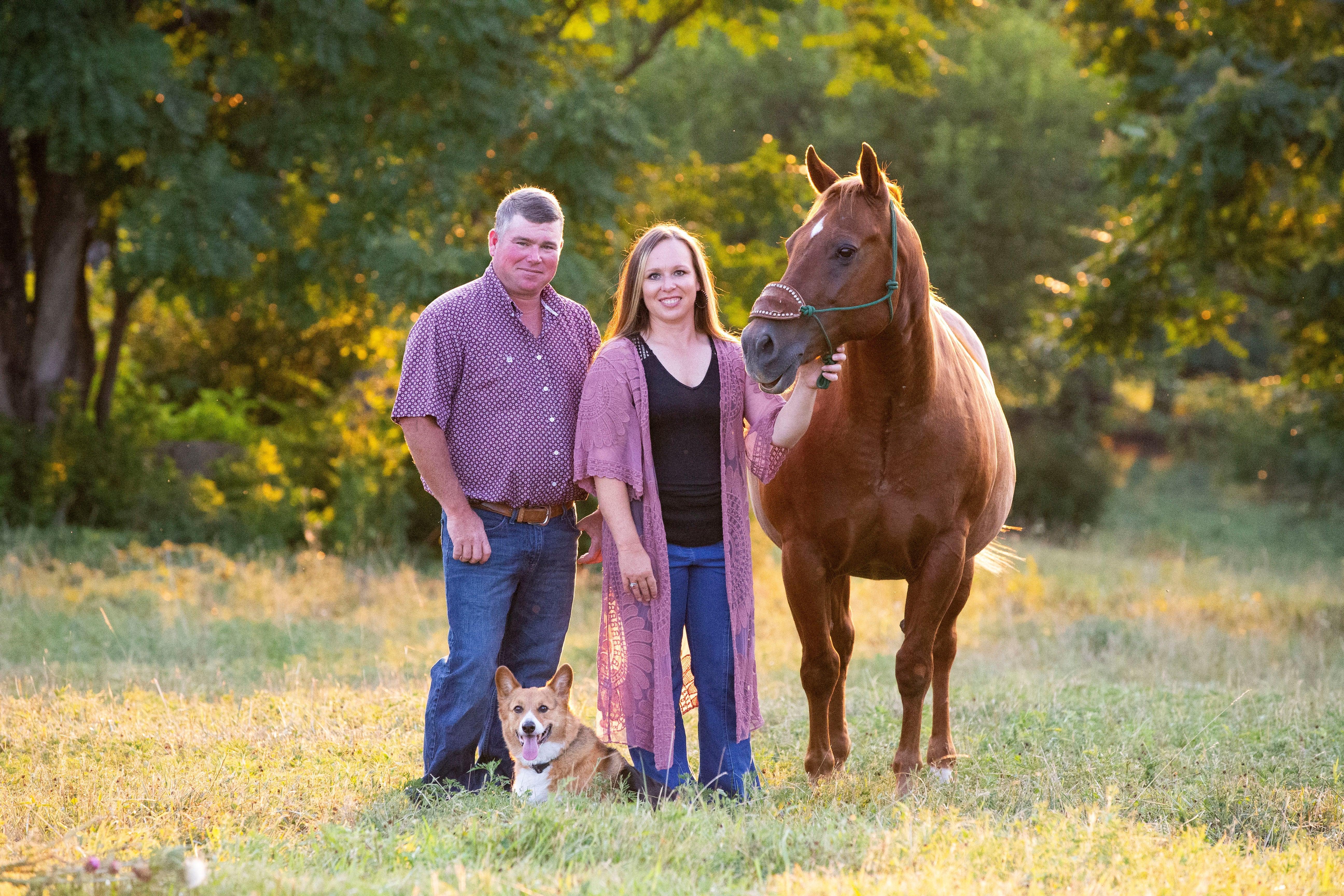 family photo with horse and corgi